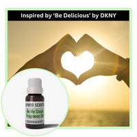 Seven Scents be my crush  fragrance oil bottle with a heart-shaped hand gesture in the background, inspired by 'Be Delicious' by DKNY.