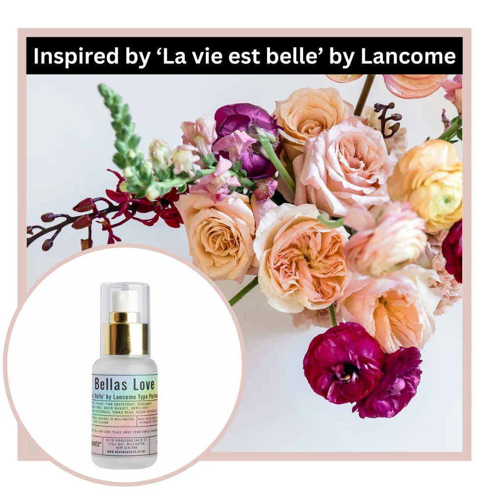 Bottle of 'Bellas Love' perfume with a floral arrangement inspired by 'La vie est belle' by Lancome.