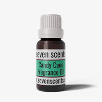 Candy cane fragrance oil bottle with a white cap on a white background