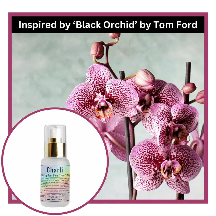 Pink orchids with a Charli perfume bottle 'Inspired by Black Orchid by Tom Ford'.