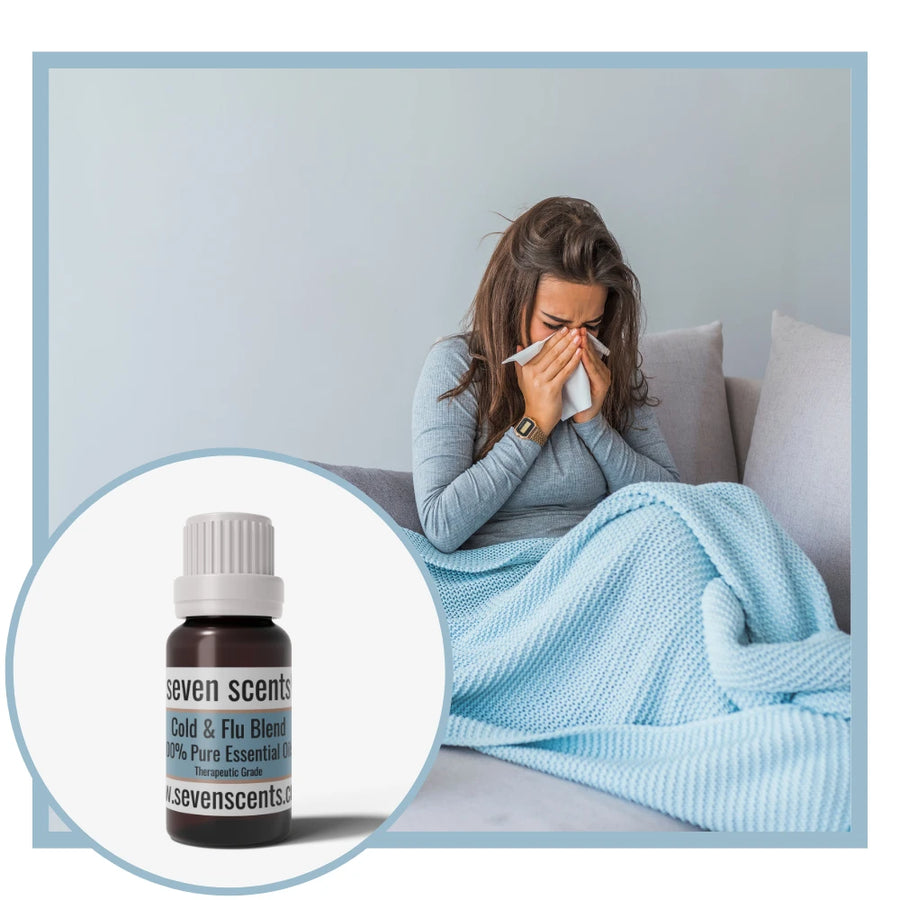 Cold and Flu essential oil blend by Seven Scents with a woman under a blanket blowing her nose