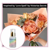 Bouquet of flowers with a perfume bottle labeled 'Enchantment' inspired by 'Love Spell' by Victoria's Secret.