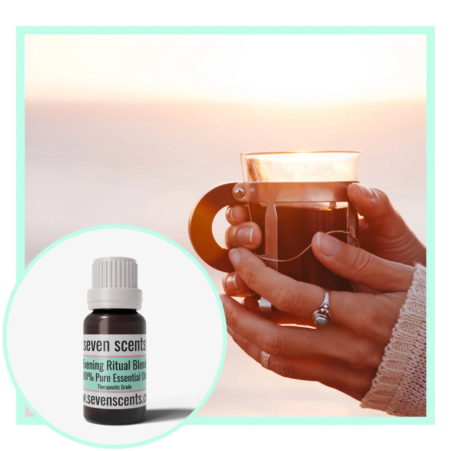 Evening Ritual essential oil blend by Seven Scents with a woman resting with a cup of tea in the evening