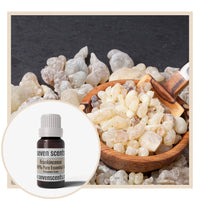 Frankincense essential oil by Seven Scents with frankincense resin in a wooden bowl