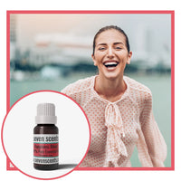 Happiness essential oil blend by Seven Scents with a happy smiling woman