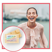 Woman laughing outdoors with inset of happiness wax melts packaging.
