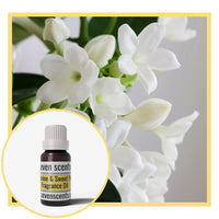 Jasmine sweet pea fragrance oil bottle with white jasmine flowers in the background
