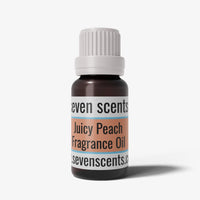 Juicy peach fragrance oil bottle with a white cap on a white background