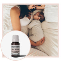 Mama Mia essential oil blend by Seven Scents with a woman holding a sleeping baby
