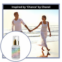 Couple holding hands on a beach with a bottle of 'Meant to Be' product inset, inspired by Chance by Chanel.