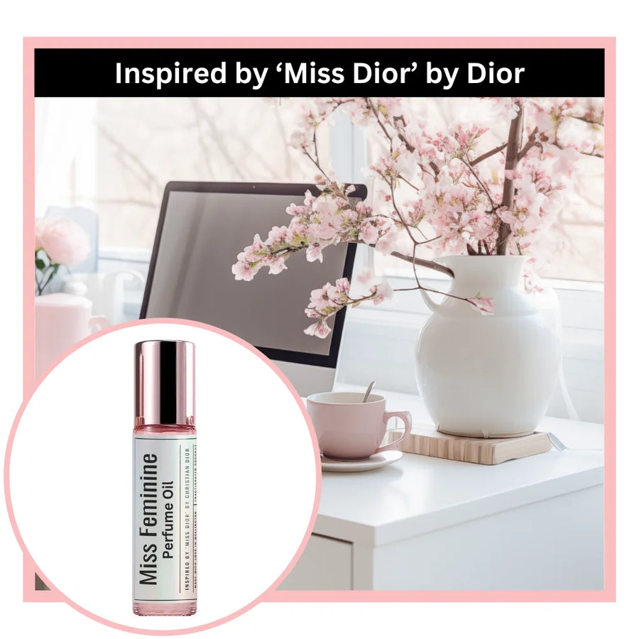Miss feminine perfume oil bottle inspired by Miss Dior by Dior with a desk and flowers.