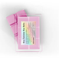 Pack of 'Miss Feminine Wax Melts' by seven scents on a white background