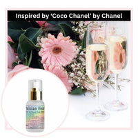 Parisian Heart perfume with pink flowers and champagne glasses in the background, inspired by Coco Chanel by Chanel
