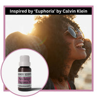 Woman wearing sunglasses with a Seven Scents pure delight fragrance oil bottle inset, inspired by 'Euphoria' by Calvin Klein.