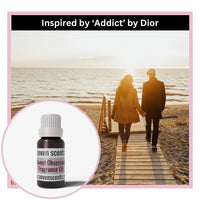 Sweet obsession fragrance oil - inspired by addict by dior, with two people walking on a wooden pier by the beach in background