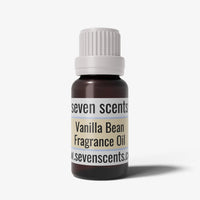 Vanilla bean fragrance oil bottle with a white cap on a white background